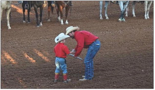 GENERATIONS OF TRADITION Post Stampede Rodeo volunteers prepared for the action in the arena during the 86th annual event. | AMY MASON PENNELL