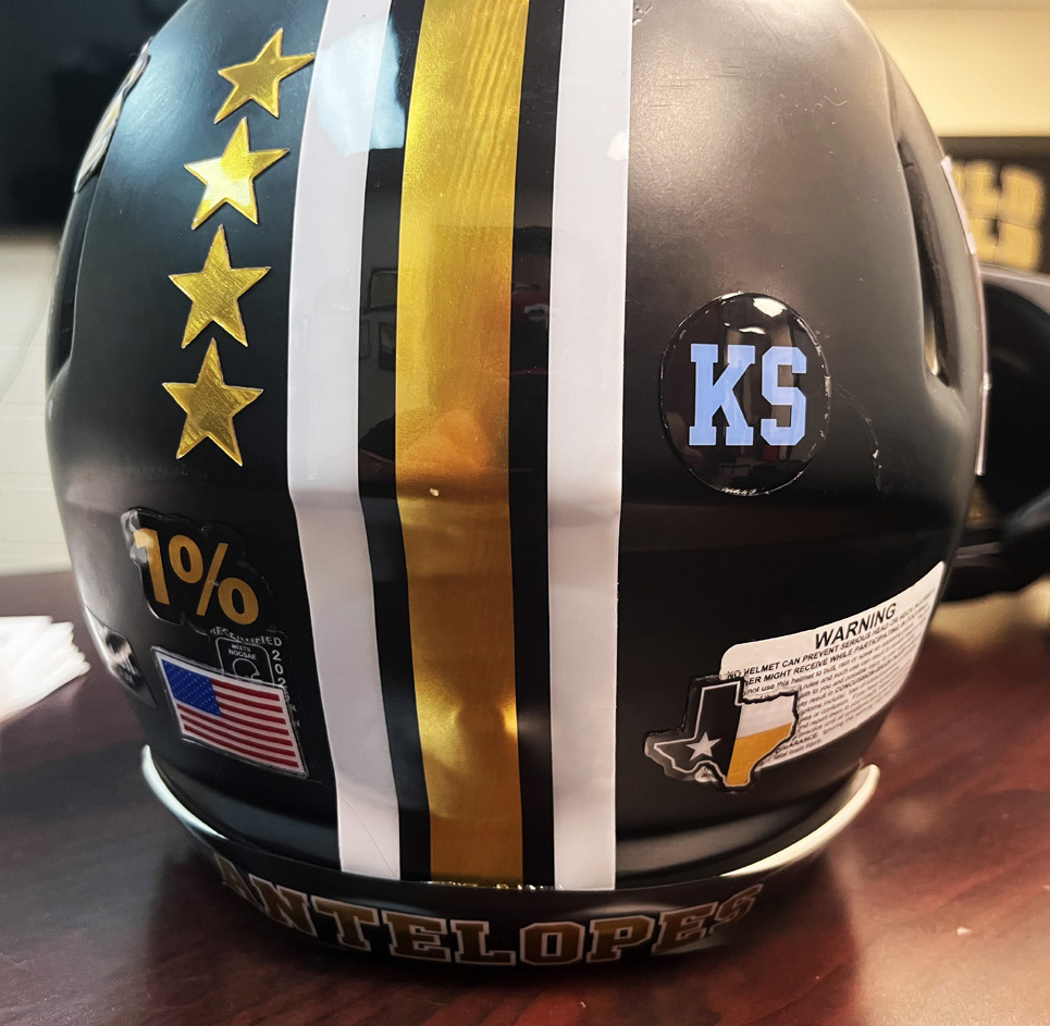 SPECIAL TRIBUTE Post Bold Gold Antelope players wore special baby blue helmet stickers bearing Kyler Smith’s initials during the Sept. 25 game against Hawley. | RUSS MORRIS