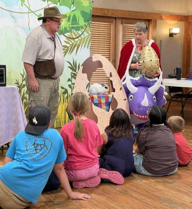 DINOSAUR STORIES Program characters “Wisconsin Johnson” and“Princess Fabbie”interactede with Post youngsters during the summer reading event at Heritage House on June 9. | STEPHANIE ALLEN