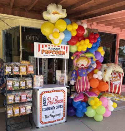 COMMUNITY TREATS Post Beacon Community Church of the Nazarene sold popcorn and cake pops during Stampede Saturday, offering sweet treats to visitors enjoying the community event. | STEPHANIE ALLEN