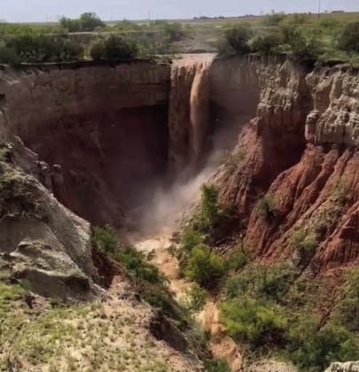 During the torrential rains last week, a waterfall was created by the runoff water from fields on 380 West. As the water swept through cotton fields and pastures, the final destination was the waterfall on the caprock created by the rains that brought 3.5 to 5.5 inches to the area. Photo by John David Fields