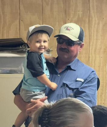 Ray Mason with his grandson Nash Mason working hard in the office.