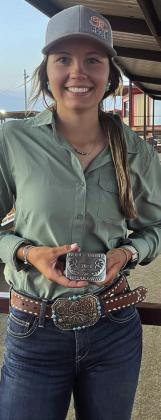 SENIOR BREAKAWAY Sylee Peterson holds her buckle after winning the Noel White Breakaway Senior Roping. | COURTESY PHOTO
