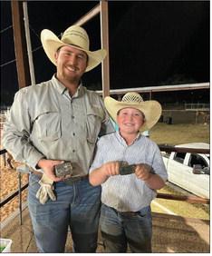 OPEN ROPING Kasen Williams (11) and Carter Roberson hold their buckle prizes after the big win in the Open Roping. In addition, Williams won the Junior Breakaway. | COURTESY PHOTO