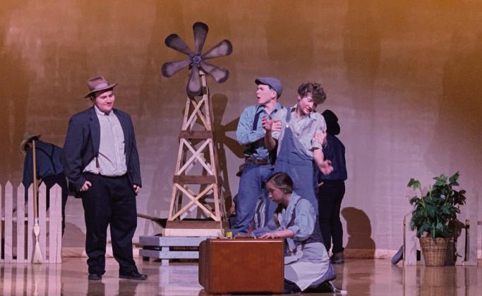 ON STAGE The Diviners One Act Play was performed by the Post High School students during the District Competition Tuesday. The Layman family welcomes C.C. Showers to their home. Pictured is Jonah Pequeno playing C.C. Showers, Branson Harris playing Ferris Layman, Maxximus Cole playing Buddy Layman, and Harli Jo McClellan playing Jennie Mae Layman. | POST DISPATCH PHOTO
