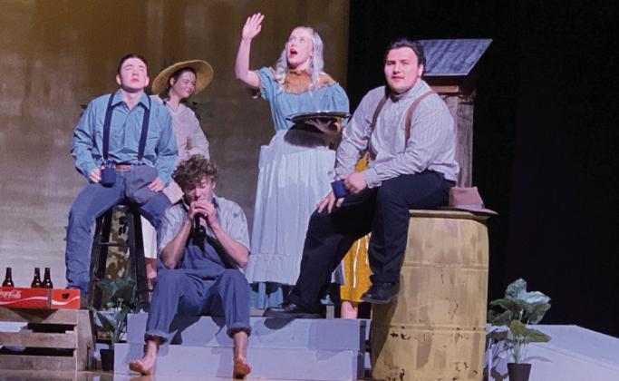 THEATERTROUPE UILOneActPlayTheDivinersisperformedbythe PHS students. Ferris Layman played by Branson Harris sits with C.C. Showers played by Jonah Pequeno and Buddy Layman played by MaxximusColeforarefreshingdrinkattheDine-Away-Cafeowned by Goldie Short played by Maddie Hart. | POST DISPATCH PHOTO