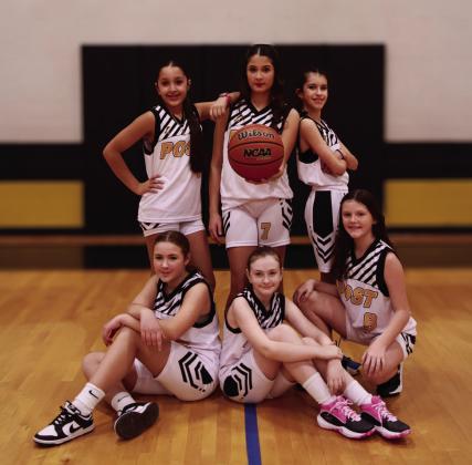 Girls 5th/6th Coach Daniel Redman, Sponsor Rafter R Ranch, and players Lyncolnn Lot, Olivia Abraham, Maegan Redman, Maylen Mendez, Ella Smith, Harper Menjares, and Cora Garrett. | WHITNEY DORSETT
