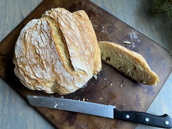 DUTCH OVEN BREAD This recipe is simple yet yields bakeryquality results with just flour, yeast, sugar, salt and water. Using a no-knead method and minimal rise time, the bread is ready in about three hours. The preheated Dutch oven creates a soft interior and crisp crust, making it a versatile and rewarding option for both beginners and experienced bakers. | ANGELINA LaRUE PHOTO
