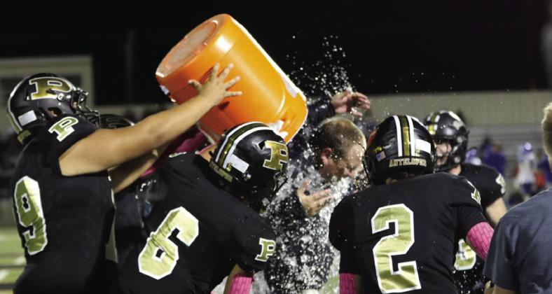 Coach Hayden Patterson gets the celebratory dousing after the win over Tahoka.