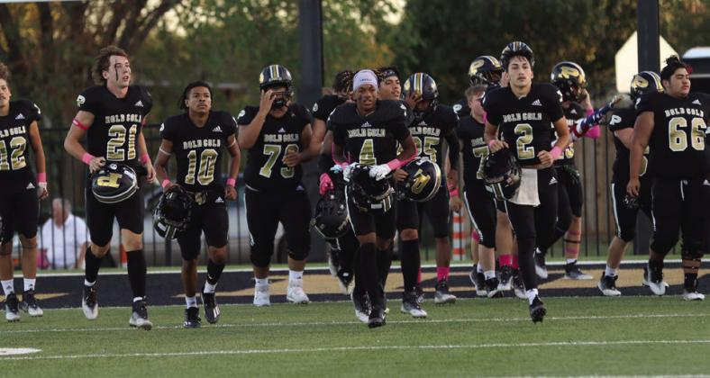 Cruz Navarro leads the team to the sidelines after the team huddle!