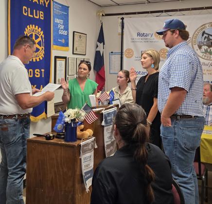 MEMBER INDUCTION Rhett Parker, led the induction of new Post Rotary Club members Traci Jarrett, left, and Stephanie Allen during the club’s June 9 meeting. | COURTESY PHOTO