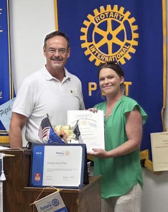 NEW MEMBER Traci Jarrett, executive director of the Post Area Chamber of Commerce, received her Rotary membership packet during her induction into the Post Rotary Club on June 9. | COURTESY PHOTO