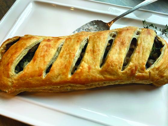MUSHROOM WELLINGTON is a culinary delight you won’t want to miss! This dish beautifully combines earthy, rich mushrooms with a flaky, golden pastry that envelops a rich filling, creating a comforting yet sophisticated dining experience. | ANGELINA LARUE PHOTO