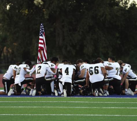 The Bold Gold Antelopes take a moment of silence before facing the Sundown Roughnecks in Week 9 action last Friday.