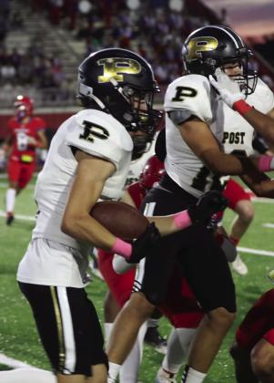 Senior Cory Mason blocks for Cruz Navarro, who carries the ball for a total of 111 yards in Week 9 game against Sundown.