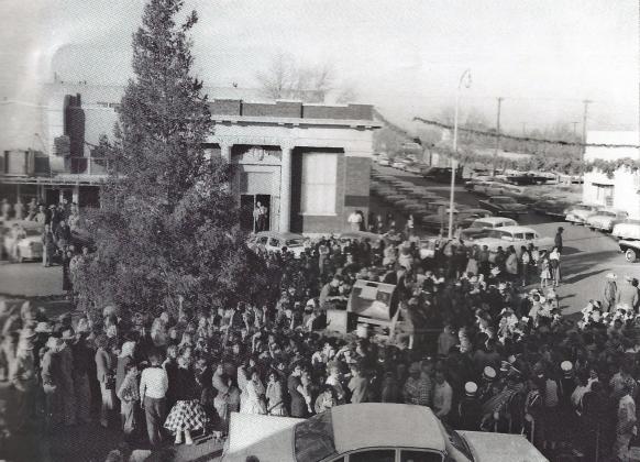 Crowds gather for the lighting of the live Christmas tree in the 1960’s in downtown Post. The tree will be lighted then Santa will arrive. Kid will be looking for him everywhere, even from the sky, maybe. Courtesy Photo