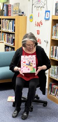 HUGS FOR HEAD START Post librarian Pam Humble welcomed Windham Head Start students Wednesday with festive stories and activities. | POST DISPATCH