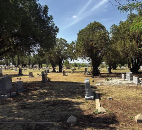 MARKER REALIGNMENT Several headstones in the Post Cemetery have shifted over time, leaving some markers tilted and misaligned among the gravesites. | COURTESY PHOTO