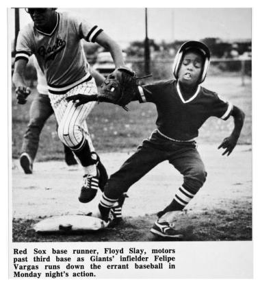 RIGHT SAFE AT THIRD In June 1983, during a Post Little League game, Red Sox baserunner Floyd Slay raced past third base as Giants infielder Felipe Vargas pursues the baseball. | POST DISPATCH ARCHIVES