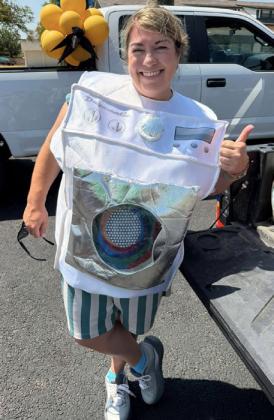 LAUNDRY FUN Amy Rektenwald represented Antelope Wash N Dry in the 2026 Post Stampede Rodeo parade, where the business was named one of three open category winners and received a $50 prize. | COURTSY PHOTO