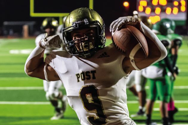 Ian Vergara scores another touchdown for the Bold Gold and over 1,000 yards rushing for the season. Photo by Ron Francis