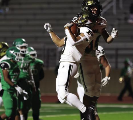 Bold Gold Senior Steve Gonzales and Sophomore Ian Vergara celebrate another touchdown. Photo by Abigail Rodriguez