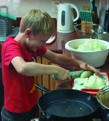 4- H COOKING The Garza County 4-H club now has a second cooking challenge team who will be competing with other counties on November 5 in Levelland. Samuel Gibson is shown slicing an onion.The new team consists of Samuel Gibson, Philemon Gibson, and E. J.Webb. Their instructor is Paul Gibson. | PHOTO PROVIDED