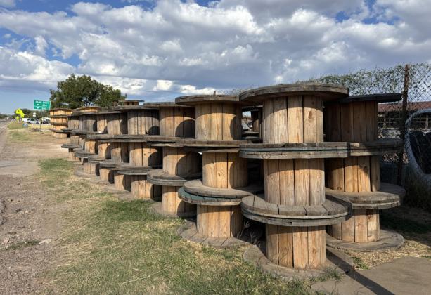 EMPTY SPOOLS were stacked after the large safety barrier project on Highway 84. The spools sit and wait for a truck to collect. | PAULA JACKSON PHOTO