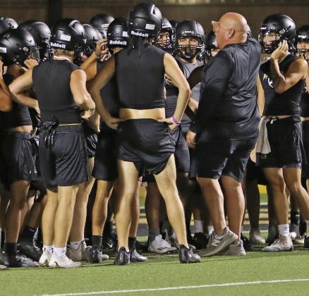 Head Football Coach John Wright addresses the students suited up for the beginning of the 2023 football season. | PHOTO BY ABIGAIL RODRIGUEZ