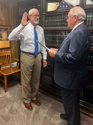 Garza County Judge Lee Norman recently administered the oath of qualification to County Judge-elect Ted Weems, who is unopposed on the November ballot, certifying that Weems meets the legal qualifications to serve as county judge. | COURTESY PHOTO
