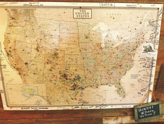 AMERICA LOVES BBQ On the wall in Smokin’ Dick’s Barbecue hangs a large map filled with pins that specify just where folks have come from to eat barbecue in Post. Dick and Shellee Odom are amazed at the stories told and the friends made from folks that come from far and near. | PAUL GIBSON PHOTO