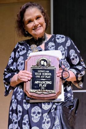 HEADED TO BI- DISTRICT Director Deborah Garoui holds the District 4-2A Advancing Play plaque after Post High School’s championship performance of “Telmah in Death.” | COURTESY PHOTO