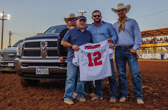 Courtesy Photo Rodney Tidwell received the '12th Man' award from Randon Blacklock, owner of Premier Autos of West Texas. Rodeo board members Wacy Moore and Miles Underwood were present for the award. Rodney is Director/Paramedic at Post-Garza Co EMS.