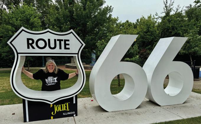 WISH YOU WERE HERE Postcard and photo props—like this one in Joliet, Illinois—abound all along the 2,448 miles of historic Route 66 from Chicago to Los Angeles. | NEWSPAPER PHOTO