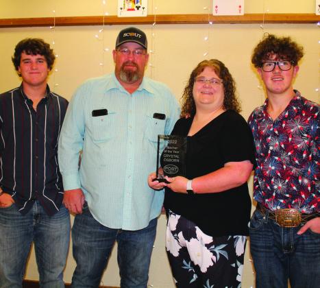 2022 Teacher of the Year - Elementary Teacher Crystal Osborn with her family Cooper, Will and Kody.
