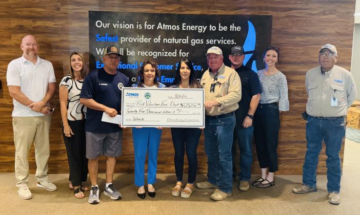 COMMUNITY SUPPORT Jake Hantz, representing Atmos Energy, presented a $25,000 donation to the Post Volunteer Fire Department, reflecting the company’s continued commitment to supporting local first responders and strengthening the community. From left are Hantz, Brandi Price, Jimmy Valdez, Nora Caballero, Elsa Longoria, Kevin Larpenter, Derrick Smith, Bradie Armstrong and Steven Rocha. See ATMOS, page 8. | COURTESY PHOTO
