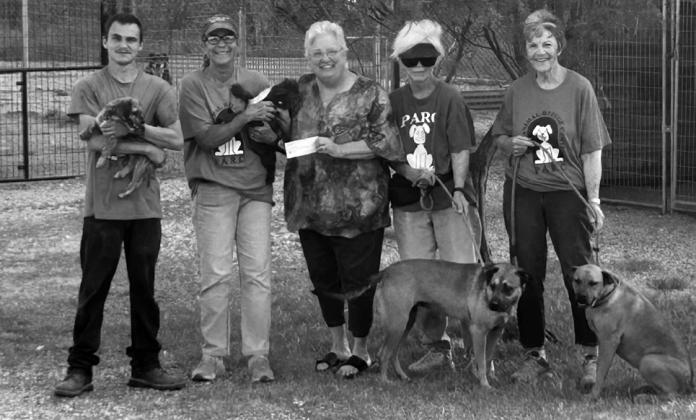 GIVING BACK Amy Weems, representing Garza County’s Amity Study Club, presented a donation to Janice Plummer and PARC (Post Animal Rescue Center) volunteers Traven Lawrence, Margie Maestes and Beth Cook. | COURTESY PHOTO
