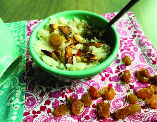 While rice is still hot and in the saucepan, stir in coconut milk, remaining teaspoon of vanilla, and maple syrup. Add the raisins and let cook, stirring occasionally, for 15 minutes. Preheat broiler. Place almonds onto a small baking pan. Sprinkle evenly with sugar. Place under the broiler for 2 to 3 minutes to toast until golden brown, (watch closely to avoid burning). Divide pudding into dishes to serve, and top with a portion of brûléed almonds. Makes 3 to 4 servings. Photo by Angeline LaRue