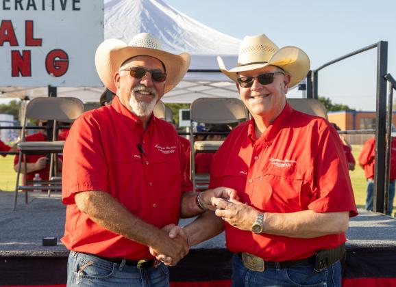 TIME TO RETIRE AND RAISE COWS Greg Henley (right) will retire as CEO of Lyntegar Electric Cooperative this month after a 40-year career with the cooperative. Board president Ben Franklin presented a token of appreciation from the organization. | COURTESY PHOTO