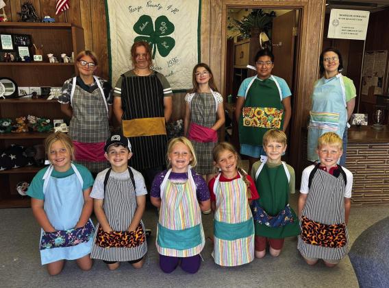 SEWING CLASS 4-H students met at the Garza County Extension Office for a sewing class last Wednesday, each creating their own apron. In the back row, Trinity Arocha, Brooklyn Hyndman, Amelia Miller, Aalayah Guerrero, and Sarah Palmer. In the front, Morgan Tadlock, Samuel Reiter, Sara Tadlock, Zoee Ray, Samuel Gibson, and Connor Griffin. | XANE REITER PHOTO