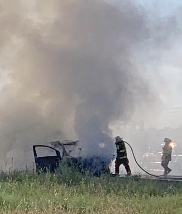 SATURDAY FIRE Officials halted traffic on busy U.S. 84 in Post Saturday evening while firefighteres put out a vehcile fire of unknown origin. Occupants of the vehicle were unharmed. | POST DISPATCH