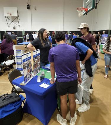 WTC COLLEGE FAIR COMING UP Isrell Lawson, WTC’s Welcome Center and Enrollment Outreach Director, speaks with prospective students at the 2025 Western Texas College Fair. | COURTESY PHOTO