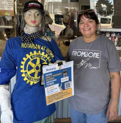 UGLY MANNY QUINN posed recently at her final 2025 stop, sporting a new hat from Kingdom Tire outside Post Family Cleaners. | COURTESY PHOTOS