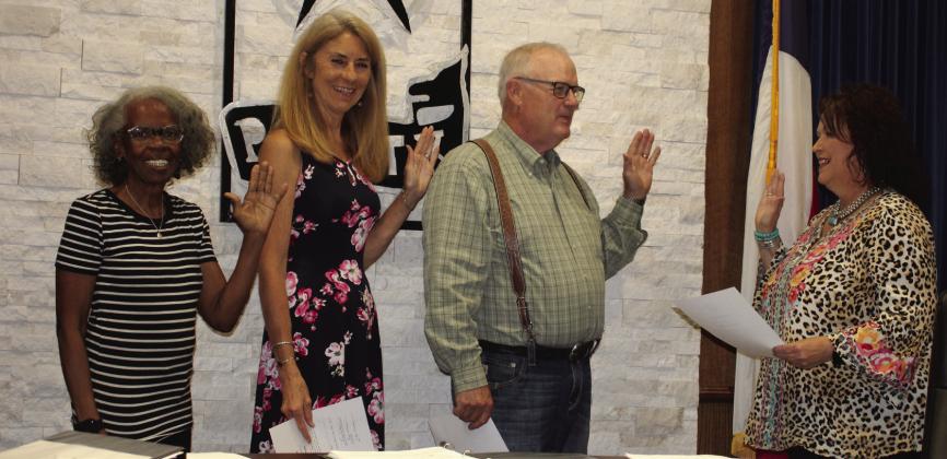 Meg Nelson, City Secretary gave the mayor and councilwomen the oath of office after the council canvased the votes at the City Council meeting Tuesday, May 9. From left to right are Evonne Sapp, representing Ward 1, Pixie Grisham, representing Ward 2, and Mayor Marvin Self.