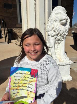 CONTEST WINNER Eva Grizzell, a Post Elementary School student, receives a gift card after winning the Garza County Museum’s Black History Month art contest. | COURTESY PHOTO