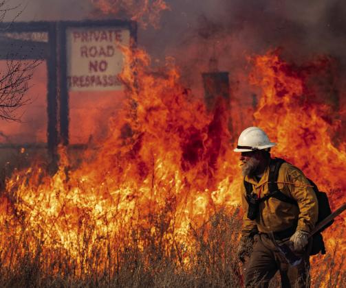 Firefighters battle flames from the reignited Smokehouse Creek fire outside of Miami. | TEXAS A&amp;amp;M AGRILIFE SAM CRAFT PHOTO