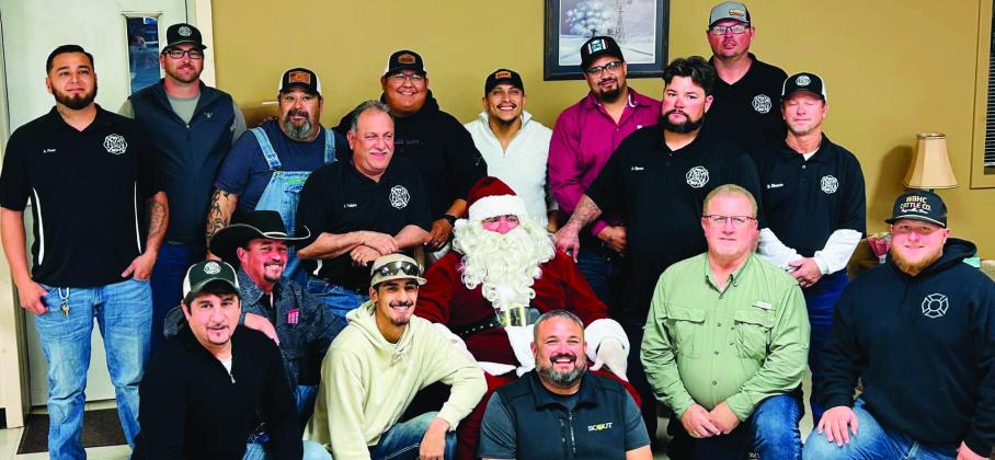 SANTA VISIT Santa made a special visit to the Post Volunteer Fire Department during their annual Christmas part last week. The department met at Garza County Trail Blazers for a meal before receiving their annual check for the calls they attended during the year. | COURTESY PHOTO