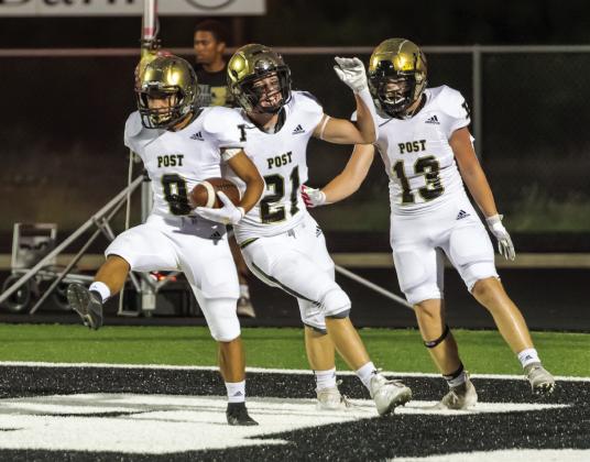 Number 9 Ian Vergara (SO) runs in for a Bold Gold touchdown celebrating #21 Jacob McClellan (SR) and #13 Corey Blacklock (JR). Photo by Ron Francis