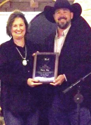 CONSERVATION RANCHER Kris Dennison presents Patsy Day with the Outstanding Conservation Rancher award for her accomplishments in stewardship and conservation of the soil, water, wildlife, and other natural resources. | PAUL GIBSON PHOTO