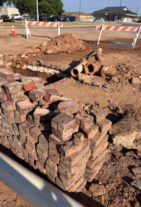 MAIN STREET BRICKS After the water lines are fixed, Sierra Hodge will replace the historical bricks on Main Street. | PAULA JACKSON, POST DISPATCH